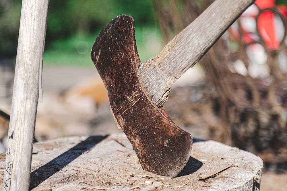 Axe filled with rust_Eric Brehm_Unsplash