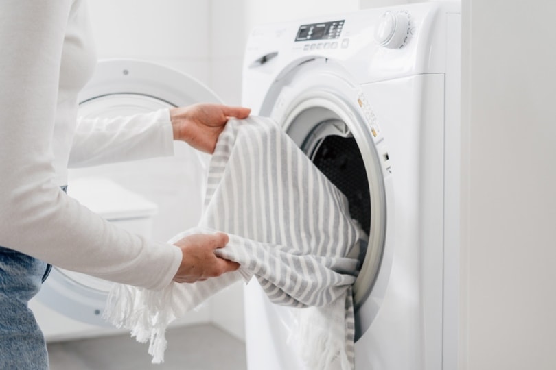 woman put towel in dryer