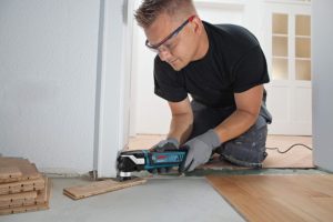 man using Bosch GOP40-30C Power Tools Oscillating Saw