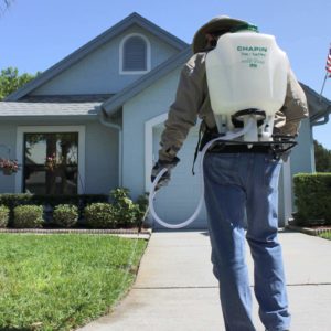 man using Chapin Tree and Turf Pro Commercial Backpack Sprayer