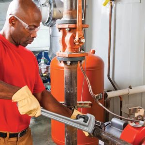 man using RIDGID 31100 Straight Pipe Wrench