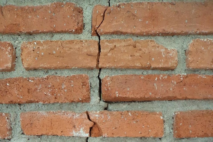 vertical crack on a brick wall