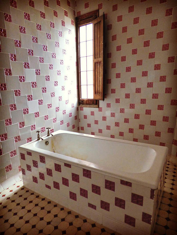 dirty bathroom with open window