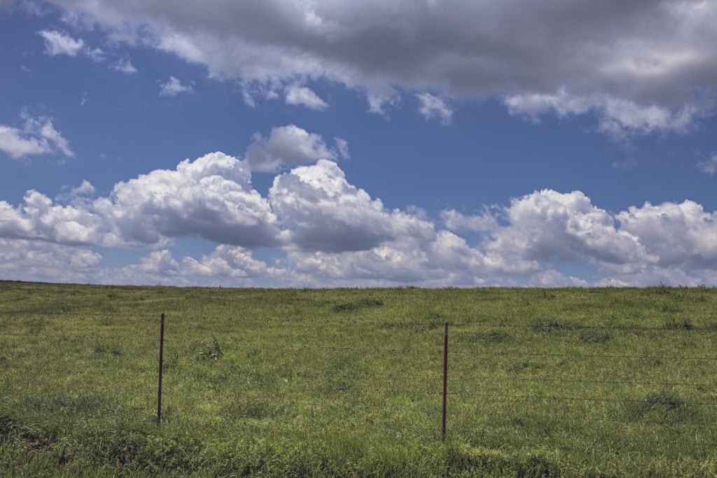 fence hills clouds