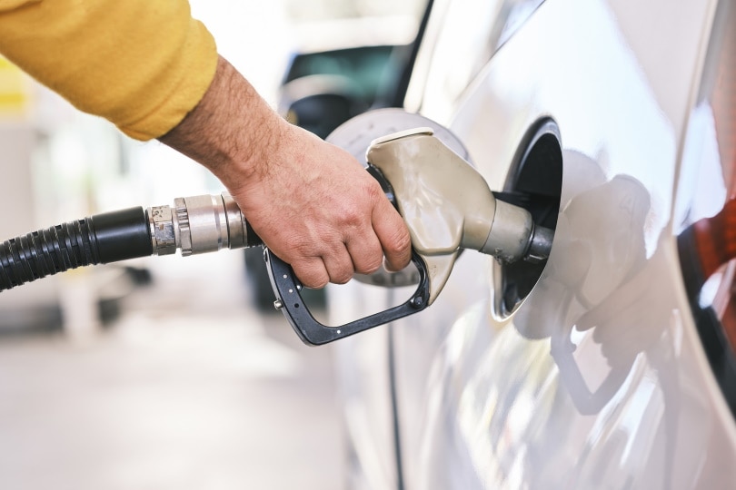 pouring fuel on gas tank