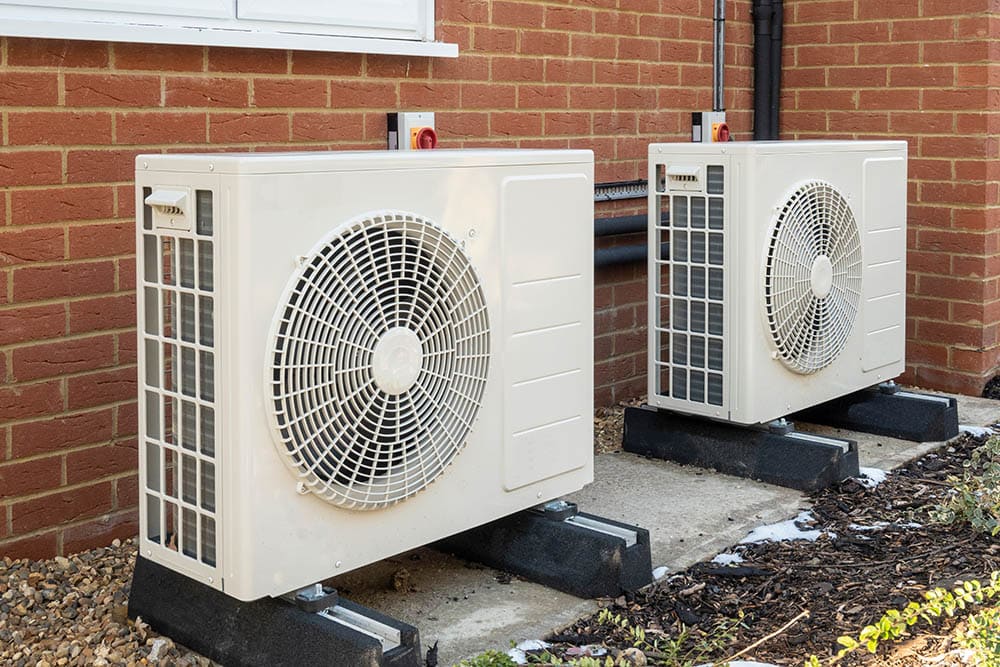 Two heat pumps outside the house