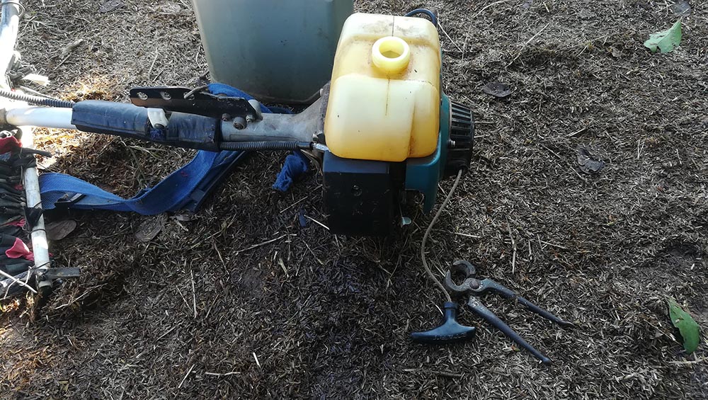 broken lawnmower in the field