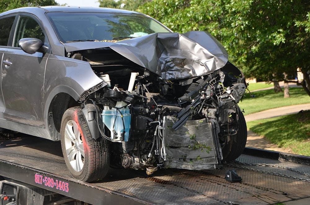 wreck car on tow truck