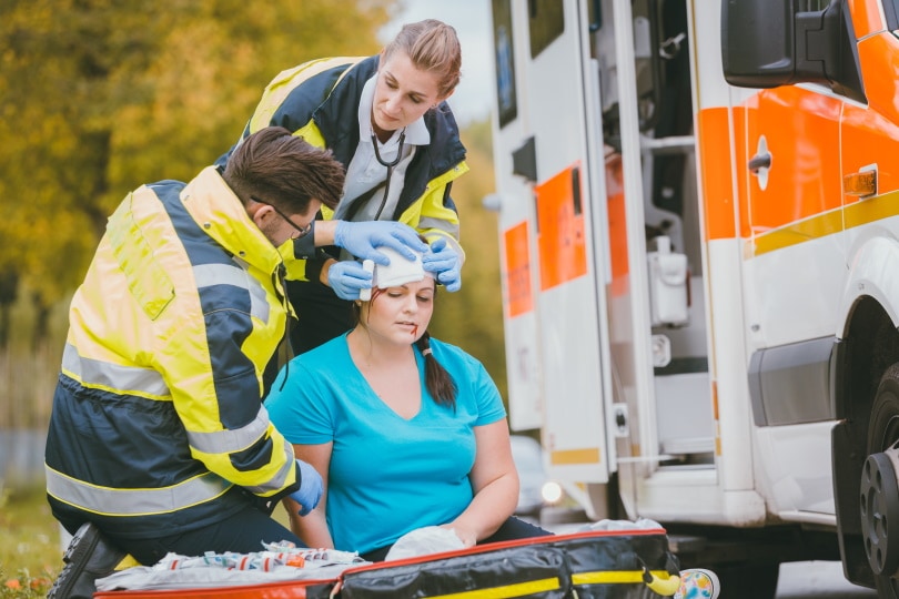 medics dressing head injury