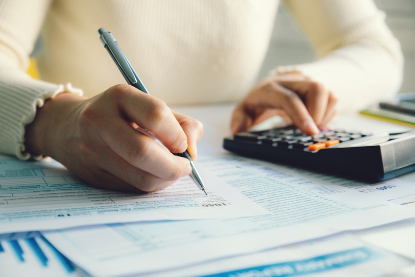 woman filling income tax form