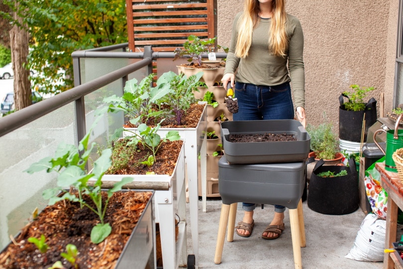 woman with compost bin